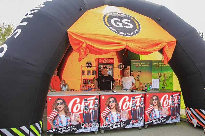 inflatable event tent with branding at a festival