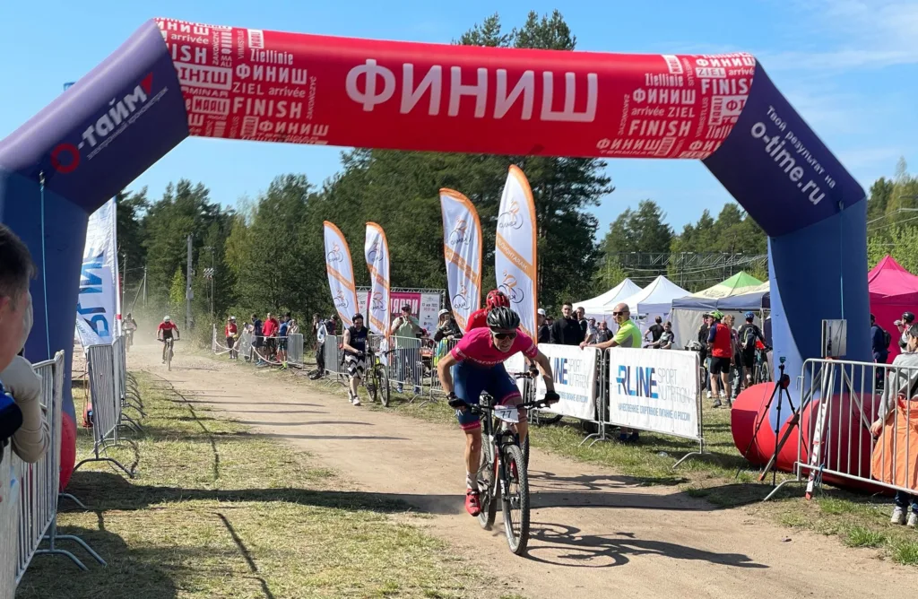 Custom printed inflatable arch with sponsor logos at an event