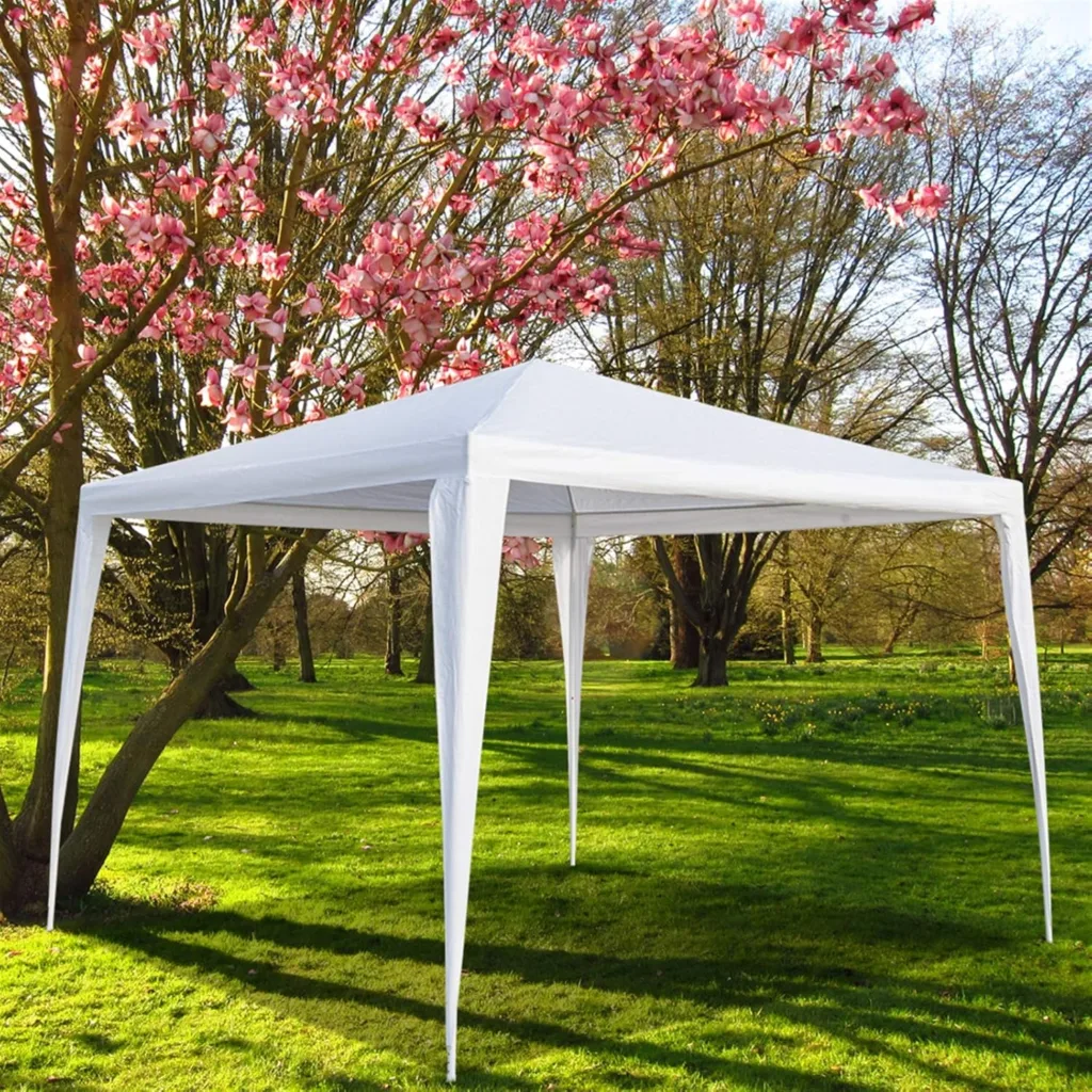 outdoor tents and gazebos set up in a backyard party
